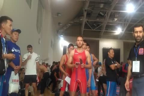 Middle Eastern men Weigh-in previous to Wrestling Tournament